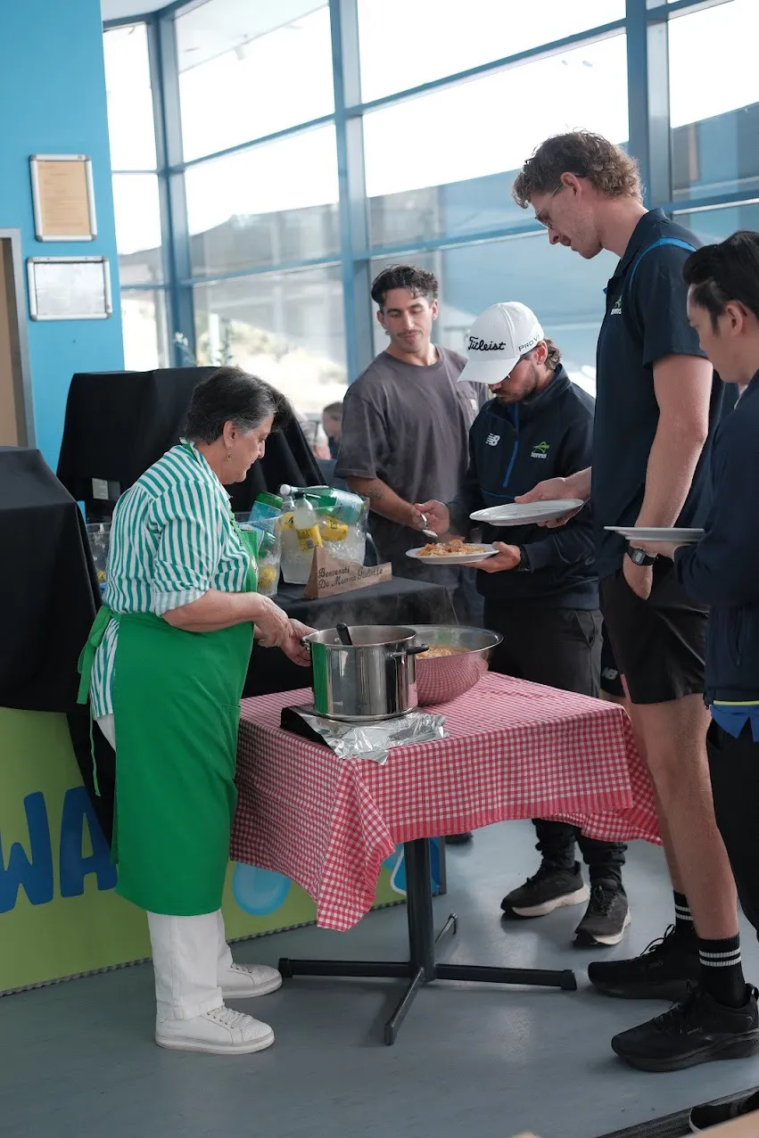 Mamma Giulietta serving fresh pasta to a team at their venue